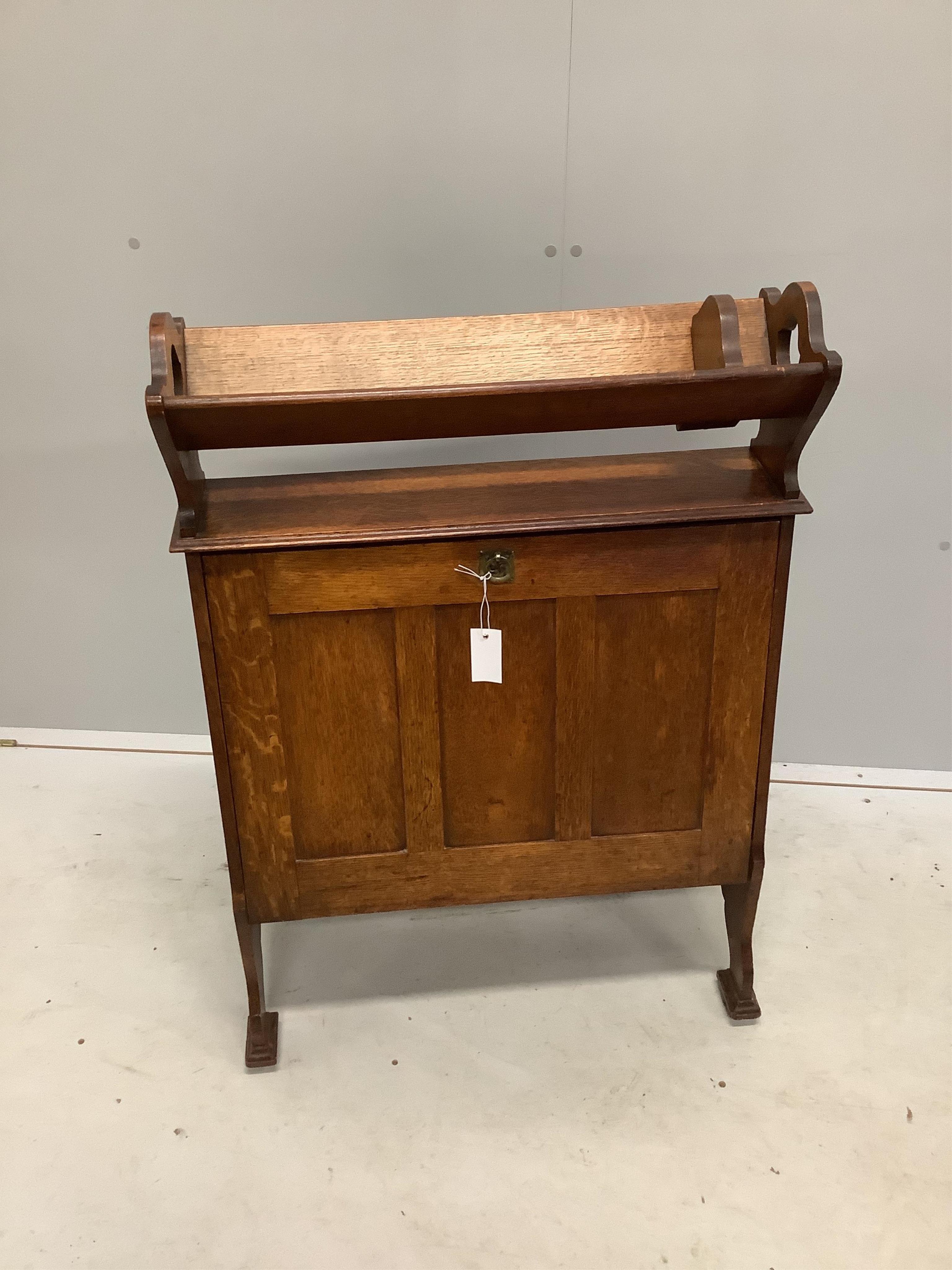 An Arts & Crafts oak folio stand/bookcase, width 70cm, height 96cm. Condition - fair to good